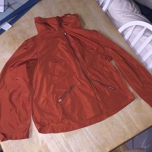 Burnt orange jacket with zipper pockets